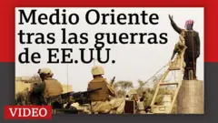 Una imagen de soldados estadounidenses con la estatua de Sadam Hussein.
