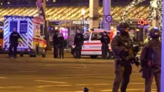 Police and ambulances stand next to di Christmas market in Magdeburg