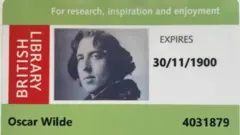 A modern British Library readers card showing Oscar Wilde's photo and name, and an expiry date 30/11/1900