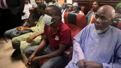 Some of di civillians wey di Nigeria govment arraign for court on top accuse say dem plan coup to comot President Tinubu by force.