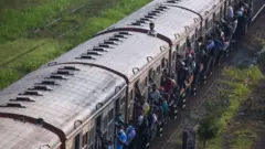 Passengers are travel in an overcrowded train during a railway workers hold a work strike in Colombo on March 15, 2023