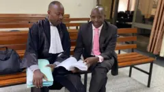 Dr Kayumba Christopher