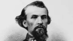 A imagem em preto e branco mostra um homem retratado em estilo de gravura ou fotografia antiga, provavelmente do século 19. Ele tem cabelo penteado para trás com laterais onduladas, barba longa e cavanhaque bem marcado, além de uma expressão séria e austera. É William Hezekiah Forrest.