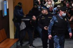 Uno de los detenidos llevado ante los tribunales.