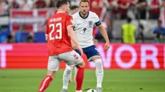 Denmark and England players face each other