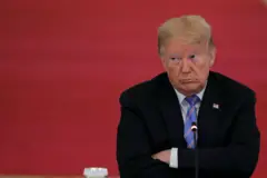 Donald Trump with his arms folded