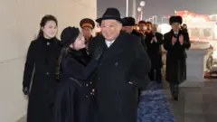 کیم و همسر و دخترش