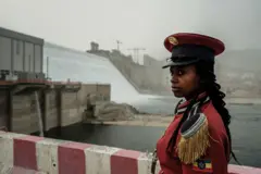 A member of the Republican March Band poses for photo before at the ceremony for the inaugural production of energy at the Grand Ethiopian Renaissance Dam (GERD) in Guba, Ethiopia, on February 20, 2022. 