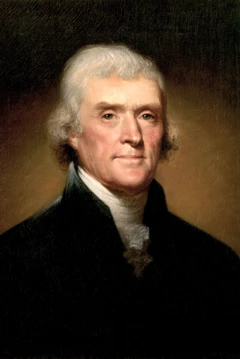 Thomas Jefferson, com cabelos brancos, vestido de branco e preto