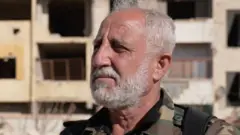 A head and shoulders shot of a man in military uniform