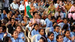 People react as they watch a live stream of Chandrayaan-3 spacecraft's landing on the moon, at an auditorium of Gujarat Science City in Ahmedabad, India, on 23 August 2023