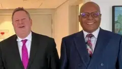 የአሜሪካ ልዩ መልዕክተኛ ማይክ ሐመር እና የኦሮሞ ፌደራሊስት ኮንግረስ ተቀዳሚ ሊቀመንበር የሆኑት ፕሮፌሰር መረራ ጉዲና