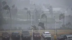 關島一處停車場在巴威吹襲下風雨交加（6/7/2026）