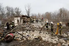 Rescuers work at a site of a residential house damaged during a Russian missile strike, amid Russia's attack on Ukraine, in Kyiv, Ukraine December 29, 2022