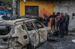 Police officers and residents during operation in Rio