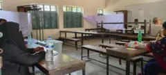 কেন্দ্রে ভোটারের অপেক্ষায় ভোটগ্রহণ কর্মকর্তারা