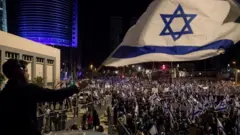 One protester wave di Israeli flag during one big protest against di goment judicial overhaul plan for 11 March 2023 for Tel Aviv