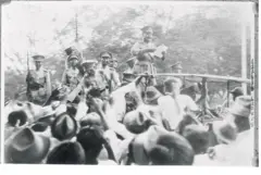 Reading 'Death Warrent' of Siam's Absolute Monarchy
Siamese Army official reading the people's party manifesto that spelled the doom of Siam's traditional absolute monarchy, one of the last to withstand the wave of post-war reform. Note the pleased expressions of the other Army officers who represent a large sector of the Army that combined with the Navy to bring about the 'peaceful' revolution curtailing the powers of the King Prajadkipok. Soldiers and sailors paraded through the streets announcing the change of Government.