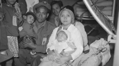 Seorang tentara Maluku bersama keluarganya di atas kapal Kota Inten, Maret 1951.