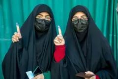 Iranian woman show dia ink-stained finger afta casting her ballot for 12th term of di parliamentary elections and di 6th term of di Assembly of Leadership Experts at a polling station on March 01, 2024 in Tehran, Iran. 