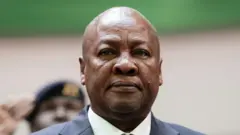 John Mahama, wear suit, e stand and dey look serious for one event for Accra, Ghana, for March 2025