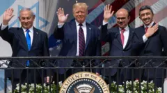 UAE's Foreign Minister Abdullah bin Zayed Al Nahyan, Bahrain's Foreign Minister Abdullatif bin Rashid Al Zayani and Israel's Prime Minister Benjamin Netanyahu with US President Donald Trump at the signing ceremony of Abraham Accords at the White House