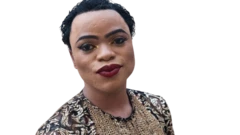 Bobrisky pose for di camera wit colour wine lipstick and jerry curl hair