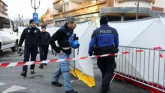Police entering the cordoned off area outside " Le Constellation" bar 