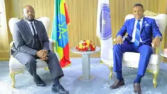 ኣምባሳደር ኤርቪን (ጸጋም) ምስ ኮሚሽነር ጀነራል ገብረሚካኤል
