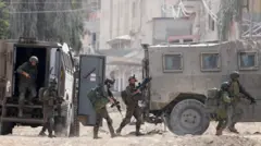 Israeli soldiers operate during a raid in the Nur Shams camp for Palestinian refugees near the city of Tulkarm in the Israeli-occupied West Bank on 28 August 2024 