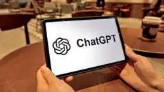A tablet with the black and white ChatGPT logo on it, being held by two hands