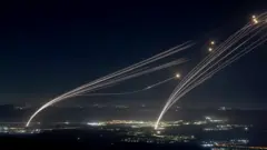 Projectiles fired from the Israeli Iron Dome air defense system to intercept missiles fired from southern Lebanon, over the upper Galilee, northern Israel, early 04 August 2024