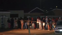 Pipo dey stand outside di scene of di shooting
