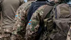 Democratic Republic of Congo Republican Guard soldiers walk in the streets of Kinshasa.