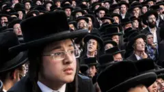 Orthodox Jews wearing black and white attire