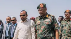 ጠቅላይ ሚኒስትር ዐቢይ አሕመድ እና የሱዳን ጦር መሪ አብዱል ፈታህ አል ቡርሃን