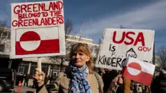Protesters rally outside the U.S. Embassy, condemning U.S. pressure on Greenland and Denmark and denouncing the U.S. government's controversial visit to Greenland in Copenhagen, Denmark, on March 29, 2025. 