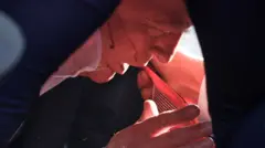 Donald Trump lies protected by Secret Service agents after gunshots rang out in Pennsylvania 