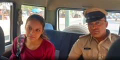 બાળકી અને પોલીસ અધિકારી