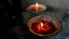 File foto of candle wey dey melt for plates