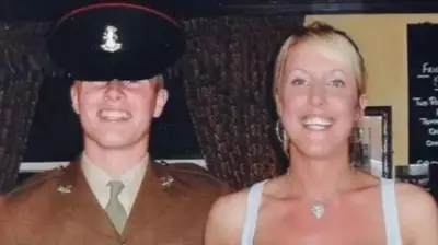 A picture of a man in army uniform and a woman in a white dress. It's a family photo