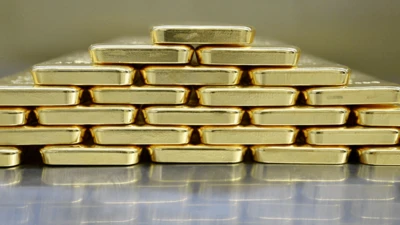 Pilhas de barras de ouro empilhadas em forma de pirâmide