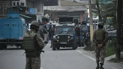  Security forces patrol the street near Wuyan area of Pampore in south Kashmir 