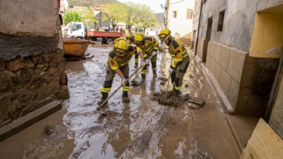 Emergency services personnel carry out drainage tasks in the flood-hit city of Montalban