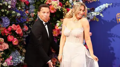 Joe Swash and Stacey Solomon show off her wedding dress on the red carpet