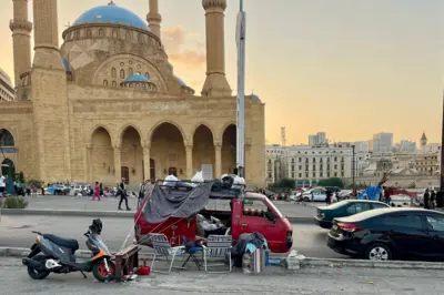 People living in a van in front of Mohammad Al-Amin Mosque