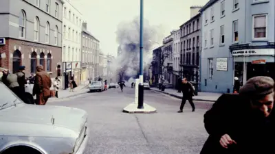 An image showing the aftermath of a bomb explosion in the street