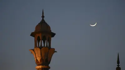 Crescent moon seen over the closed Grand Mosque of Delhi Jama Masjid during Ramadan in 2020.