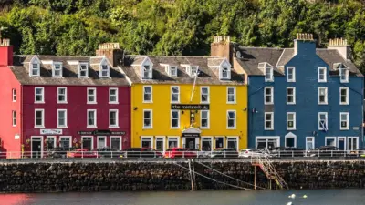 Brightly coloured houses overlook a harbour
