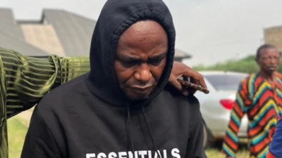 Anthony Joshua driver Adeniyi Kayode wear black hoodie